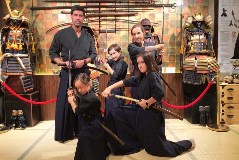 Kyoto : Family-Friendly Sword Lesson at Samurai Ninja Museum - Putting on the hakama in central Kyoto