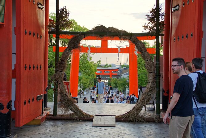 Kyoto: Fushimi Inari Shrine Walking Tour - Walking Through the Orange-Red Torii Gates