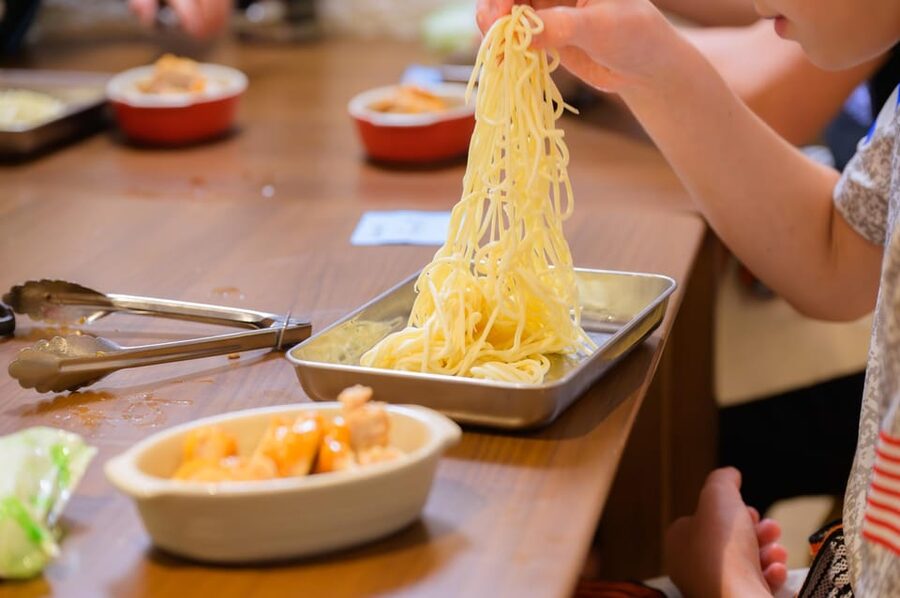 Kyoto: Ramen Cooking Class at a Ramen Factory with Souvenir - Turning flour into noodles by hand